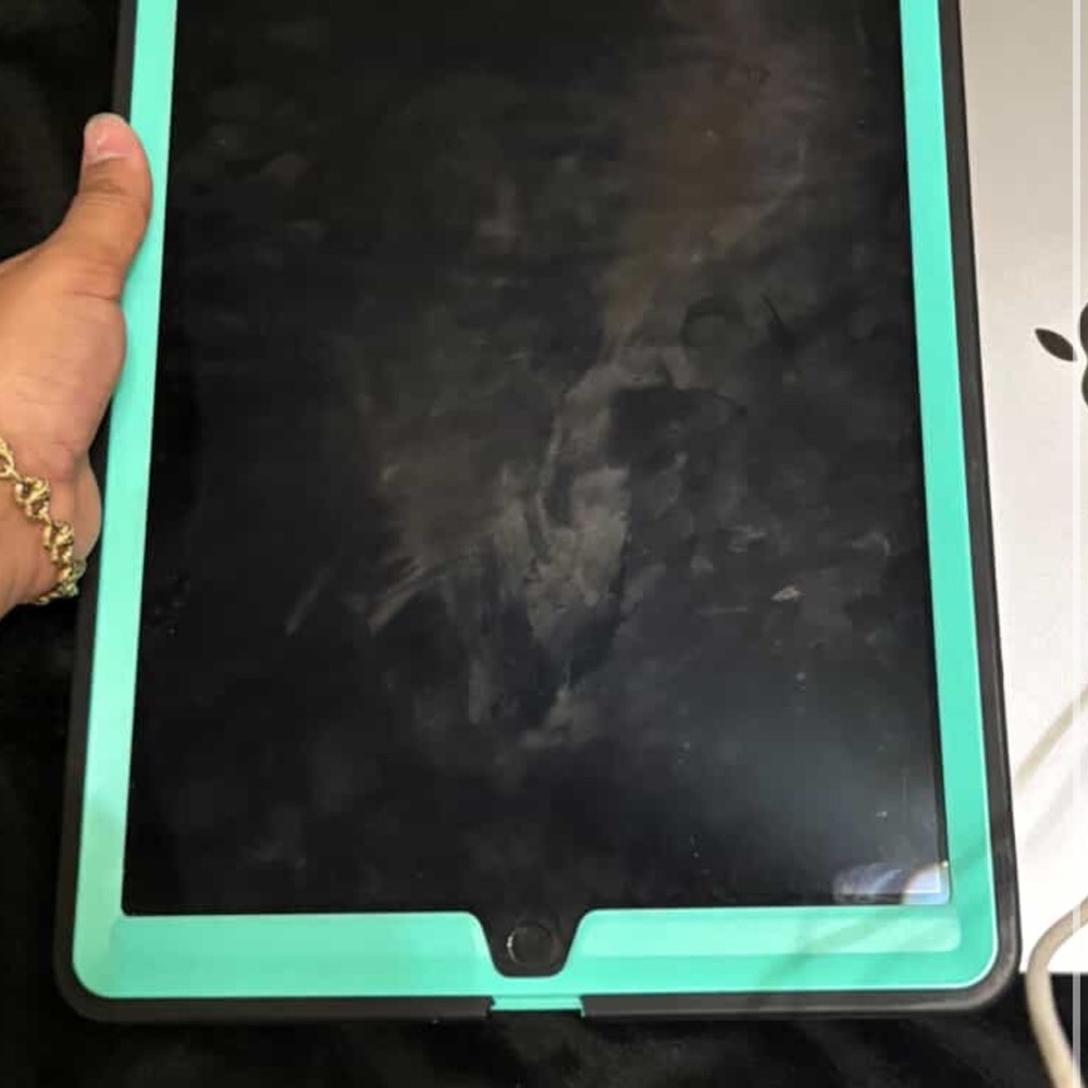 Apple Tablet with Black and Green Case